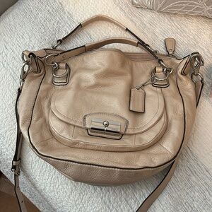Coach leather purse in beige with silver hardware.  Excellent condition.